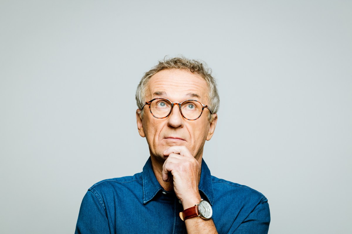 Headshot of thoughtful senior man